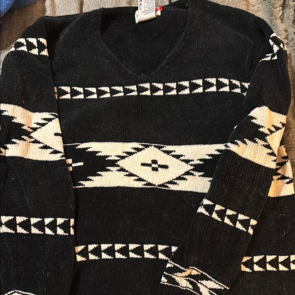Black and White V-Neck Sweater with Geometric Patterns